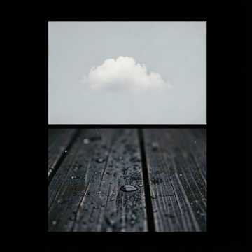 Cover artwork included with the Angel Hum soundtrack: a cloud above rain on dark timber